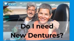 Smiling couple with new dentures fitted by a clinical dental technician